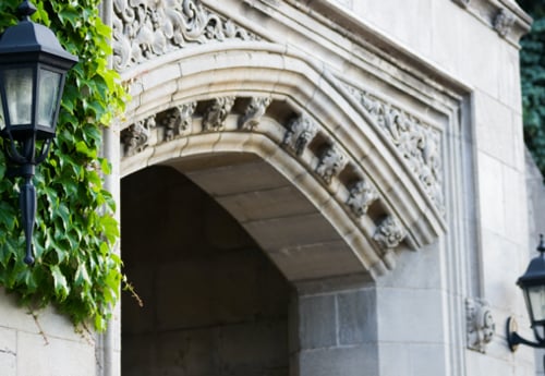 University archway with ivy and lamps University archway with ivy and lamps