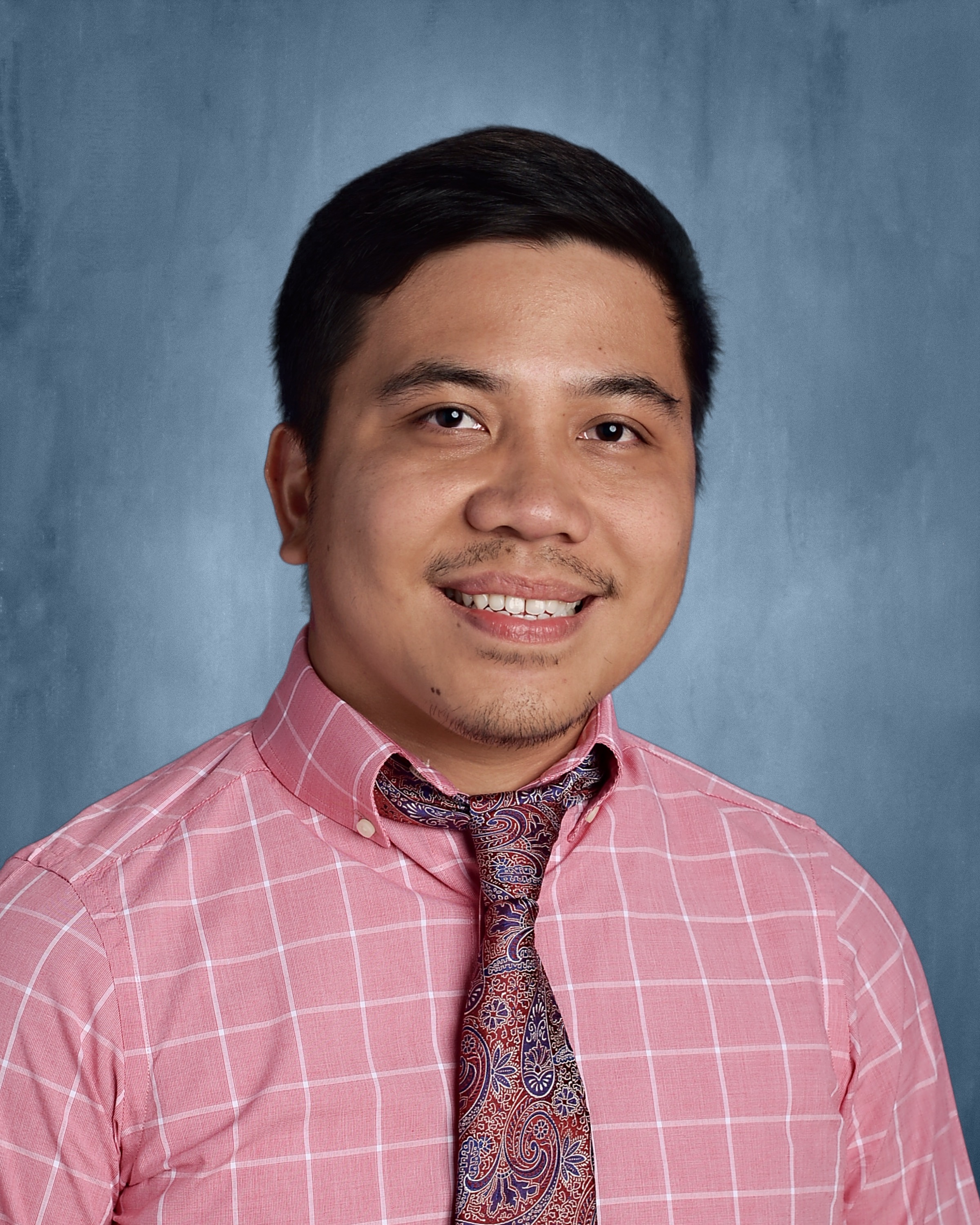 A photo of John Neil, a tutor from university of the Philippines