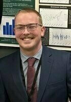 Online Microeconomics tutor named Liam