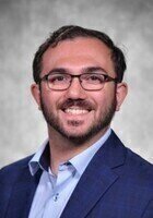 A photo of Raymond, a tutor from SUNY Oswego